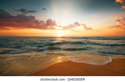 Colorful ocean beach. Sunrise shot! - Shutterstock ID 2040200309