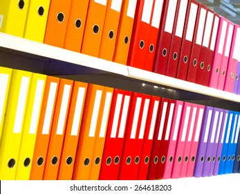 Colorful office folders on the bookshelf