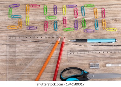 Colorful Office Paper Clips. Inscription School. White School Chalk. Wooden School Bench Top. School Accessories.