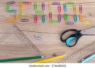 Colorful Office Paper Clips. Inscription School. White School Chalk. Wooden School Bench Top. School Accessories.