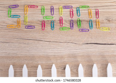 Colorful Office Paper Clips. Inscription School. White School Chalk. Wooden School Bench Top.