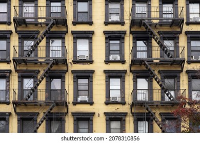 Colorful, Old Fashioned Manhattan Apartment Building Facades With External Fire Escape Ladders