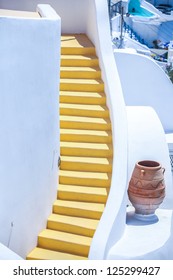 Colorful old staircase and traditional architecture on island of Santorini in Fira, Greece.