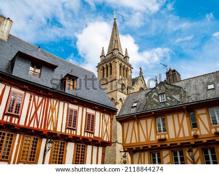 Colorful old wooden houses and St. Peter's Basilica in the historical center of Vannes, coastal medieveal town in Morbihan departement, Brittany, France
