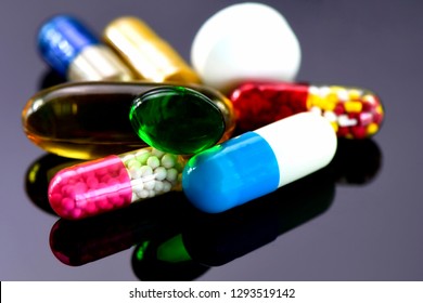 Colorful Of Oral Medications On Dark Background. Capsule And Tablet Oral Dosage Form.