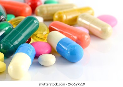 Colorful of oral medications on White Background. - Shutterstock ID 245629519