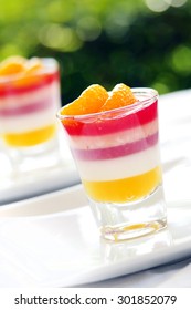 Colorful Orange Jelly - Fruit Jelly In Shot Glass.  This Dessert Made By Orange, Juice And Gelatin