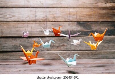 Colorful Origami Paper Cranes On Wooden Background