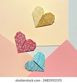 Colorful Origami Paper Hearts on Pastel Geometric Backgrounds for Valentine's Day. - Powered by Shutterstock