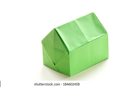 colorful origami paper house on a white background