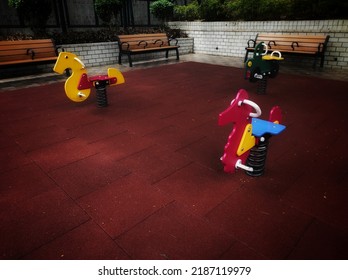 Colorful Outdoor Rocking Horse Toys in a residential garden.
