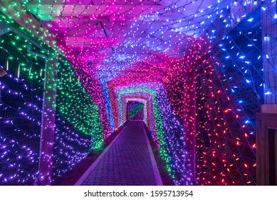 Colorful Outdoor  Tunnel Of Lights Christmas Holiday Light Display. 