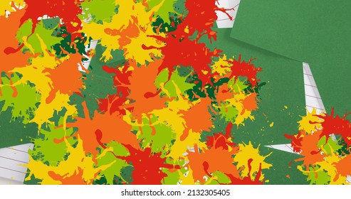 Colorful paint splashes over green memo notes and white lined paper. international creative month awareness concept - Powered by Shutterstock