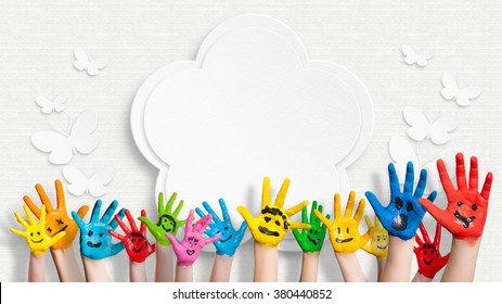 Colorful Painted Hands In Front Of A Decorated Wall With A Flower And Butterflies