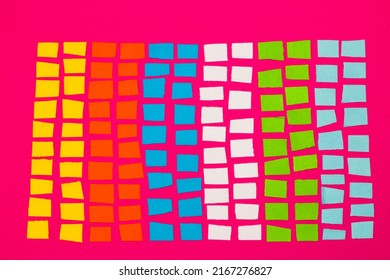 Colorful Paper Blocks, A Sheet Of Chopped Paper On A Pink Background