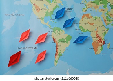 Colorful Paper Boats On World Map, Flat Lay