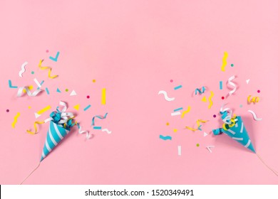 Colorful Paper Confetti Exploding On Pastel Pink Background
