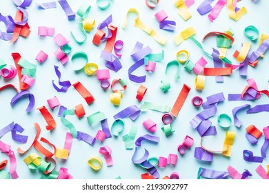 Colorful paper confetti on blue background. - Shutterstock ID 2193092797