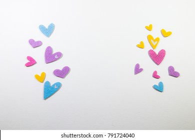 Colorful Paper Hearts On A White Backdrop.