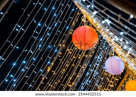 Similar – Image, Stock Photo Floating colorful paper lanterns against a dark sky