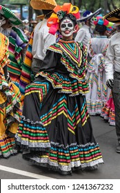 Colorful Participants In The Festival Of The Day Of The Dead In Mexico.
Attractive Skull Costumes Worn By Dancing Mexican Girls