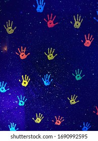 Colorful Blacklight​ Party Hand​print On​ Background​.