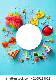 Colorful party items for carnival or birthday party on blue background with copy space