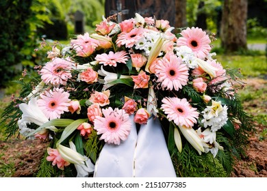 Colorful Pastel Flowers On A Grave After A Funeral