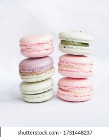 Colorful pastel macaron dessert towers on a white background 
