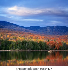 A Colorful And Pastoral Mountain Lake Scene On An Autumn Evening, Loon Lake, Adirondack Mountains, New York