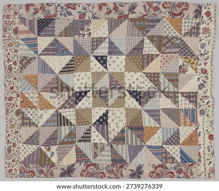 Colorful patchwork quilt with geometric patterns and floral border. Quilt features triangles and squares in various colors and prints, creating a vibrant, cozy design. Vintage pattern art illustration
