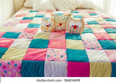 Colorful Patchwork Quilt On The Bed