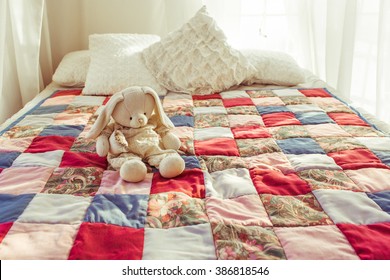 Colorful Patchwork Quilt On The Bed