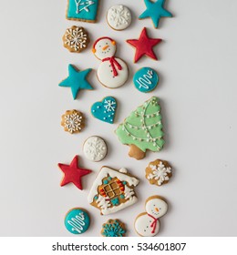 Colorful Pattern Made Of Christmas Cookies And Red Berries. Flat Lay Holiday Concept.