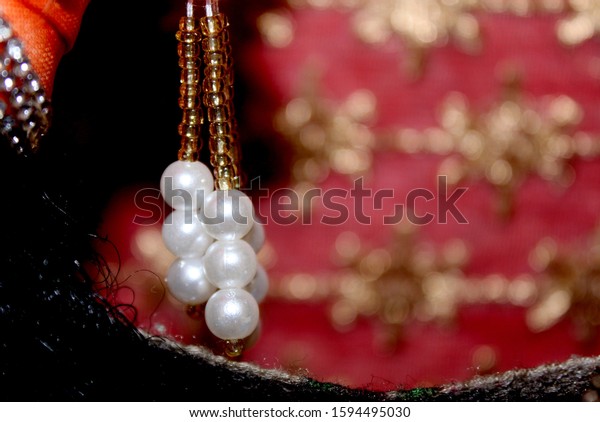 colorful Pearl strings abstract\
background row of pearl ornaments in traditional\
design