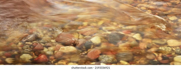 Colorful Pebble Stones Under Crystal Clear River Water, Close-up. Long Exposure. Abstract Natural Pattern, Texture, Background, Wallpaper. Concept Image, Macro Photography, Graphic Resources