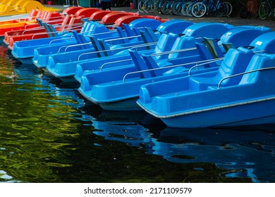 colorful pedal boats for hire in the English Garden in Munich, tourism