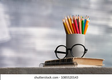 Colorful pencil on books
