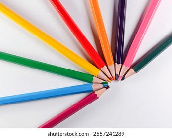 Colorful pencils arranged in a circular pattern. - Powered by Shutterstock