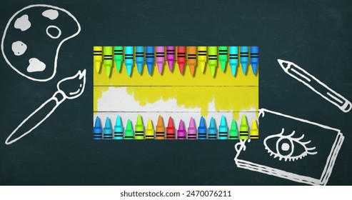 Colorful pencils on white lined paper against art concept icons on blue background. back to school and education concept