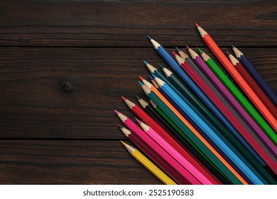 Colorful Pencils on Wooden Surface - Vibrant Art Supplies for Creative Projects - Powered by Shutterstock