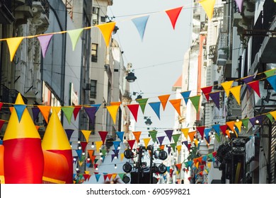Colorful pennants and lamps hung at a street fair