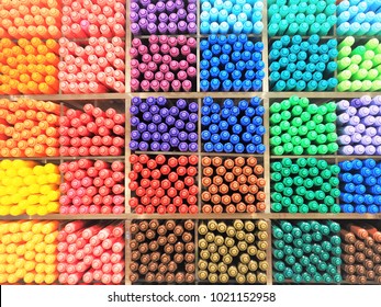 Colorful Pens In Square Shelf Of Stationary Store.