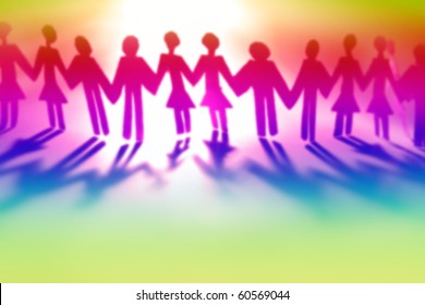 Colorful people holding hands together (blurred)