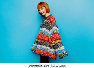 Colorful Photo Of Young Female Model Wear Oversize Sweater Isolated On Blue Background