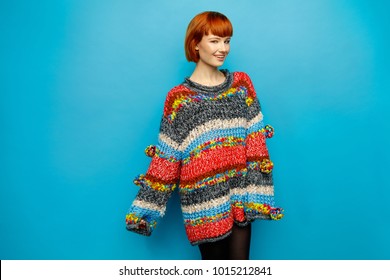 Colorful Photo Of Young Female Model Wear Oversize Sweater Isolated On Blue Background