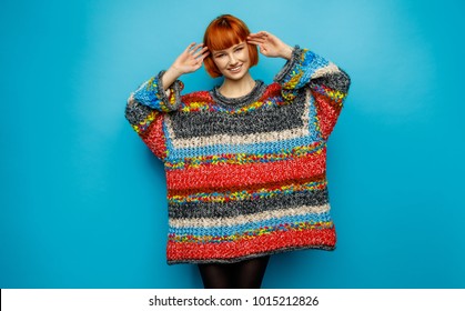 Colorful Photo Of Young Smiling Female Model Wear Oversize Sweater Isolated On Blue Background