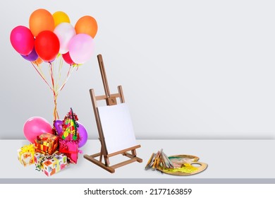 Colorful Photography Set With Balloons And Painter's Canvas On The Desk