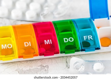 Colorful Pill Box For Weekly Dosing On White Background, Abbreviations For Days Of The Week In German, Close-up