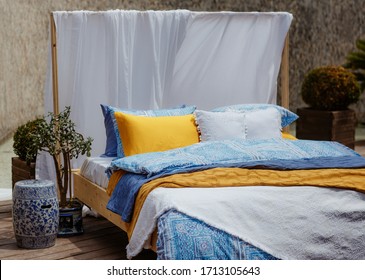 Colorful Pillows, Duvet And Duvet Case On A Bed. Beautiful Bed Linen On A Sofa. Bedroom With Bed And Bedding. Messy Bed. Front View.